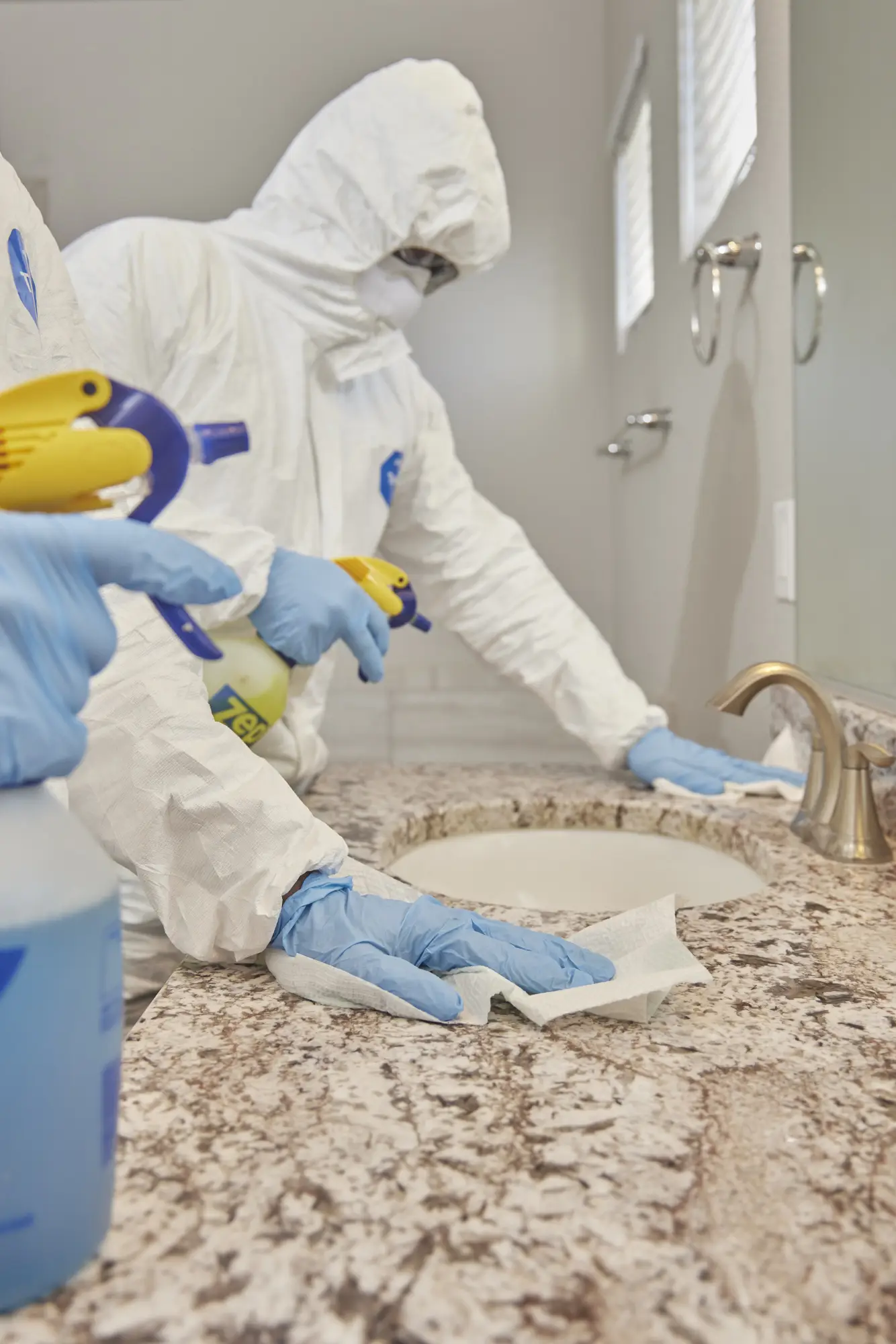 team disinfecting bathroom at hoarder's house