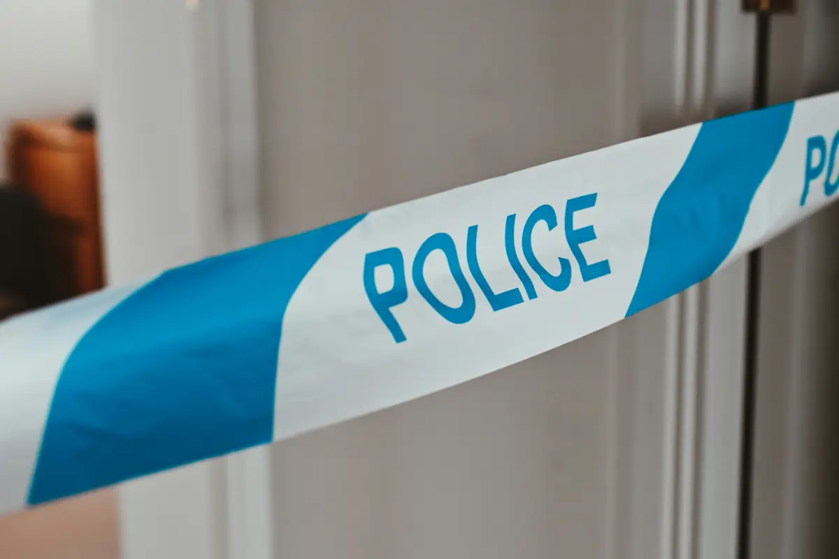 police tape across bedroom doorway